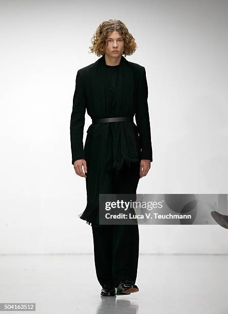 Model walks the runway at the Matthew Miller show during The London Collections Men AW16 at Victoria House on January 9, 2016 in London, England.