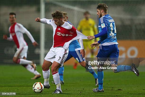 Viktor Fischer 8l9 of Ajax is challenged by Aaron Hunt of Hamburg during a friendly match between Hamburger SV and Ajax Amsterdam at Gloria Sports...
