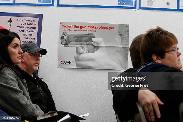 People listen during a packed class to obtain the Utah concealed gun carry permit, at Range Master of Utah, on January 9, 2016 in Springville, Utah....