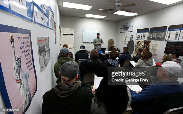 Gun instructor Mike Stilwell, teaches a packed class to obtain the Utah concealed gun carry permit, at Range Master of Utah, on January 9, 2016 in...