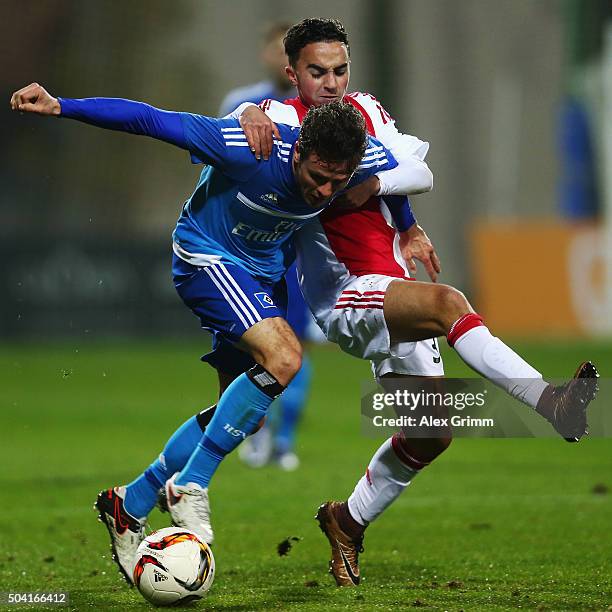 Nicolai Mueller of Hamburg is challenged by Nouri Abdelhak of Ajax of Ajax during a friendly match between Hamburger SV and Ajax Amsterdam at Gloria...