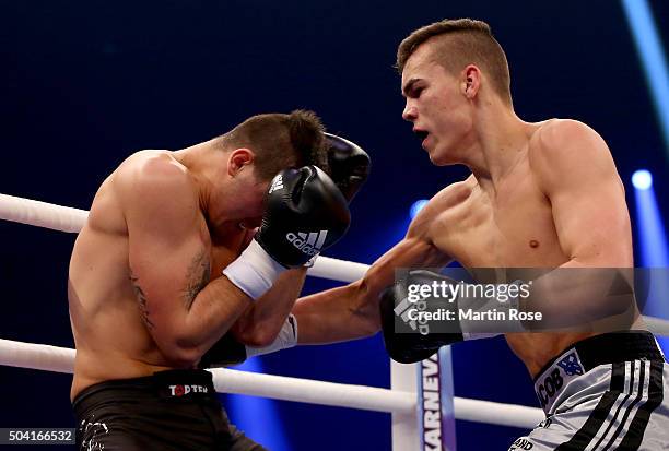 Leon Bauer of Germany exchange punches with Ondrej Marvan of Czech Republic during their super middle weight fight ahead of the WBA...