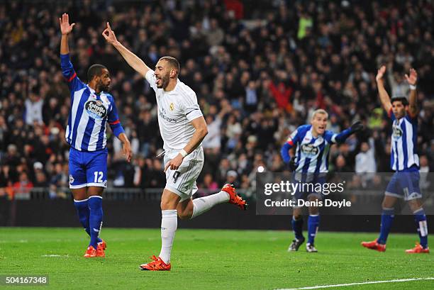 Karim Benzema of Real Madrid celebrates as he scores their first goal as Deportivo La Coruna players appeal during the La Liga match between Real...
