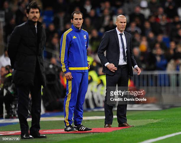 Zinedine Zidane manager of Real Madrid and Victor Sanchez del Amo manager of Deportivo La Coruna look on during the La Liga match between Real Madrid...
