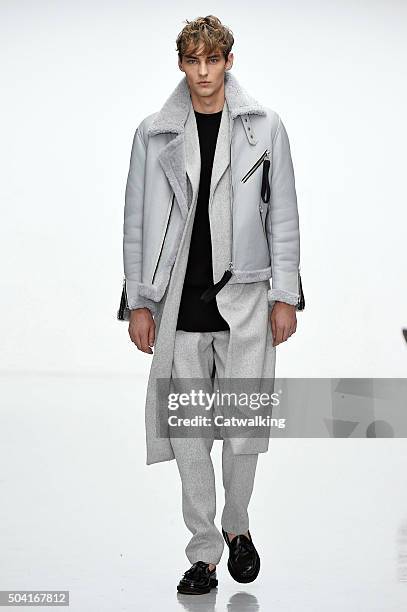 Model walks the runway at the Matthew Miller Autumn Winter 2016 fashion show during London Menswear Fashion Week on January 9, 2016 in London, United...