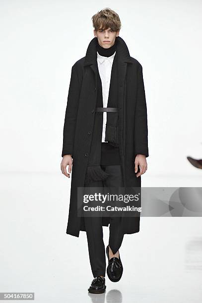 Model walks the runway at the Matthew Miller Autumn Winter 2016 fashion show during London Menswear Fashion Week on January 9, 2016 in London, United...