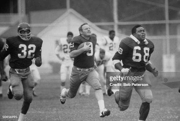 Redskins quarterback, Sonny Jurgensen , running with ball during Cleveland Browns game, at R. F. K. Memorial Stadium.
