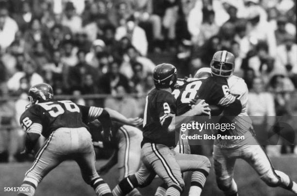 Redskins quarterback, Sonny Jurgensen , preparing to throw ball during Cleveland Browns game, at R. F. K. Memorial Stadium.