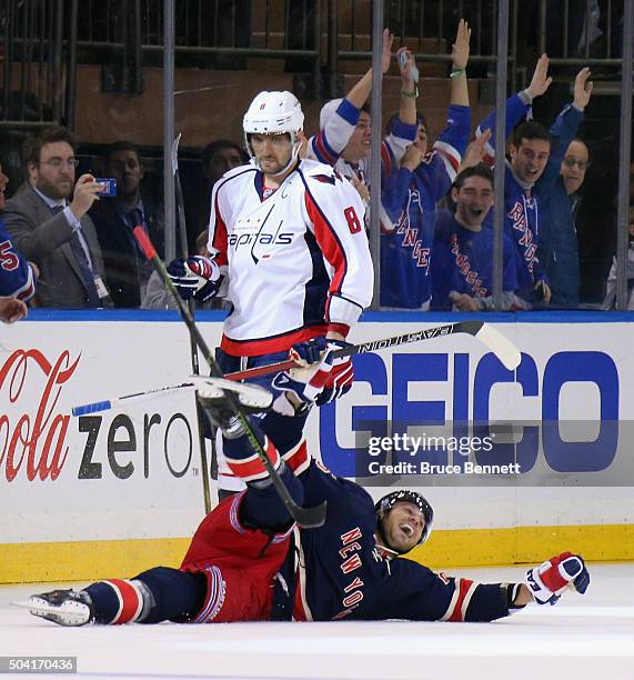 Viktor Stalberg of the New York Rangers celebrates his third period goal against the Washington Capitals as Alex Ovechkin skate by at Madison Square...