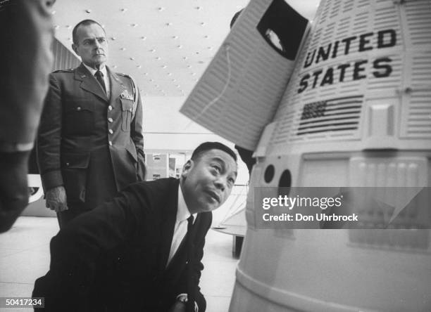 Defense Minister Ching Kuo Chiang, visiting the Manned Spacecraft Center, looking at Gemini Model.