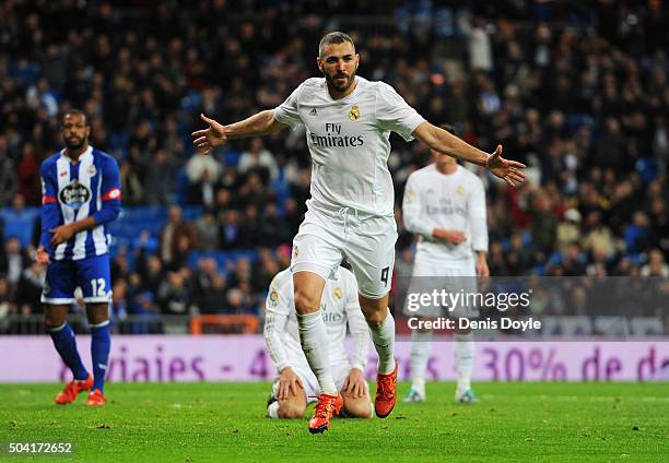 Karim Benzema of Real Madrid celebrates as he scores their fifth goal during the La Liga match between Real Madrid CF and RC Deportivo La Coruna at...