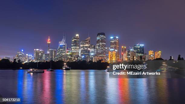beautiful scene of colorful sydney city skyline at night with reflection - circular quay stock pictures, royalty-free photos & images