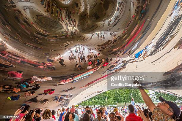 strange reflections from the bean of chicago millennium park, illinois - chicago illinois bean stock pictures, royalty-free photos & images