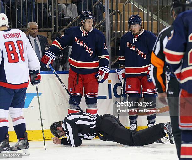 Linesman Derek Amell is injured during the game between the Washington Capitals and the New York Rangers at Madison Square Garden on January 9, 2016...