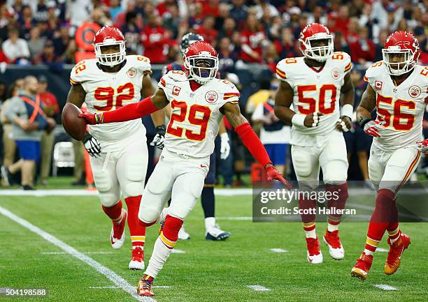 Eric Berry of the Kansas City Chiefs celebrates his first quarter interception against the Houston Texans during the AFC Wild Card Playoff game at...