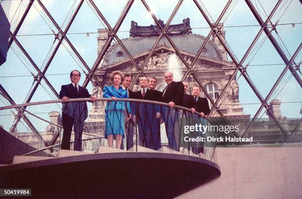 Heads of 7 leading industrial nations, and head of EC, stand-in I.M. Pei's glass pyramid at Louvre Museum: L-R: Japanese PM Uno, GB PM Thatcher, US...