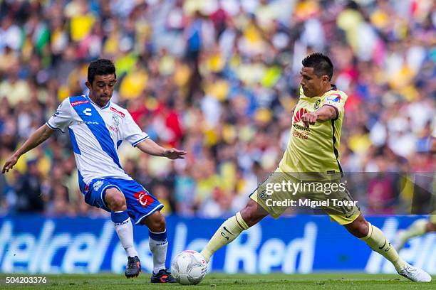 Osvaldo Martinez of America fights for the ball with Christian Bermudez of Puebla during the 1st round match between America and Puebla as part of...