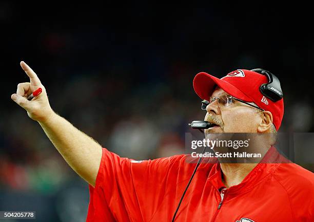 Head coach Andy Reid of the Kansas City Chiefs celebrates a fourth quarter touchdown against the Houston Texans during the AFC Wild Card Playoff game...