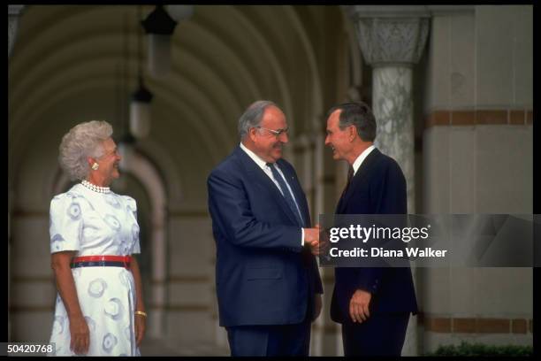 Pres. & Barbara Bush greeting W. German Chancellor Kohl w. Handshake, during opening of Econ. Summit, at Rice Univ.