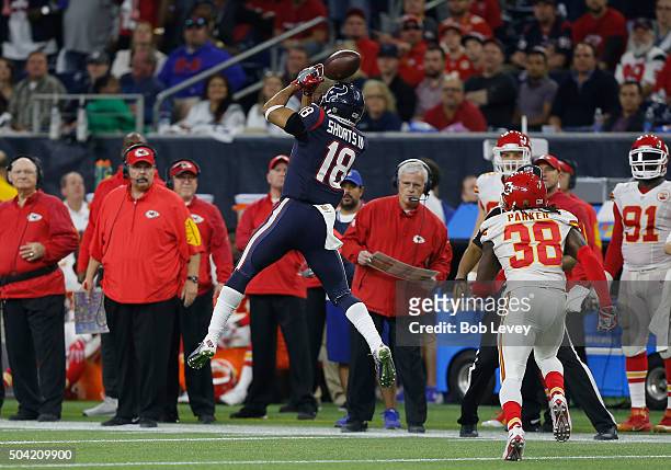 Cecil Shorts of the Houston Texans attempts to catch the ball against the Kansas City Chiefs in the fourth quarter during the AFC Wild Card Playoff...