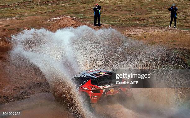 Peugeot's French driver Sebastien Loeb and co-driver Daniel Elena compete during the Stage 7 of the Dakar Rally 2016 from Uyuni, Bolivia to Salta,...