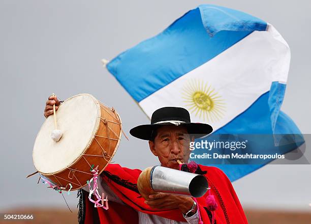 Spectator pictured with an Argentinian flag plays a Erke or horn and Caja or drum on day 7 stage seven from Uyuni in Bolivia to Salta in Argentina...