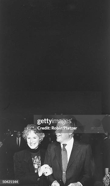 Actress Glenn Close walking arm in arm w. Her father, Dr. William Close, as they attend a benefit screening of her motion picture Immediate Family,...