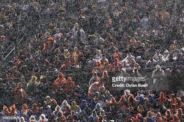 Fans look on as rain falls during the AFC Wild Card Playoff game between the Cincinnati Bengals and the Pittsburgh Steelers at Paul Brown Stadium on...
