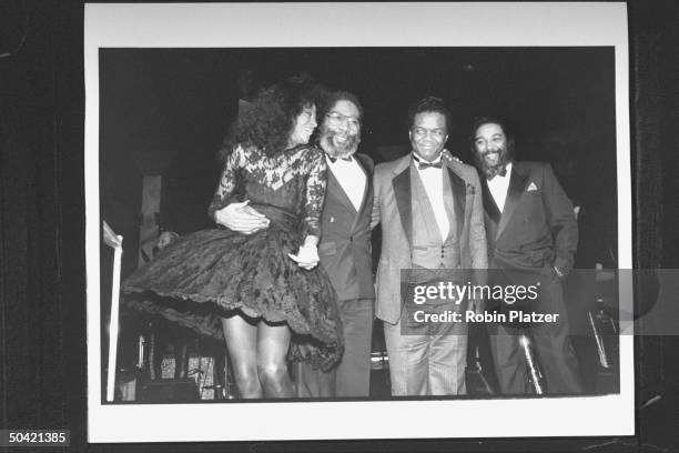 Singer Diana Ross posing w. Rock & Roll Hall of Fame inductees, songwriters Brian Holland, Lamont Dozier & Eddie Holland, the no. 1 Motown...