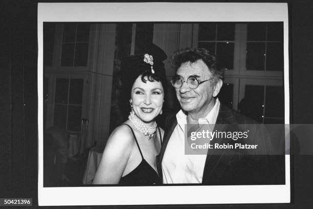 Rock music producer Bill Graham w. Posing w. Model Jerry Hall's glamorous sister, Rosie Hall, at the Rock & Roll Hall Fame induction ceremony banquet...