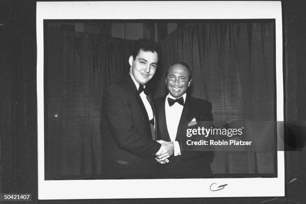 Singer Paul Anka chatting w. Dodd Cassotto the son of the late Rock & Roll Hall of Fame inductee Bobby Darin at awards banquet at the Waldorf-Astoria...