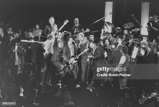Mass of rock singers & musicians fill the stage as they perform the finale at the Rock & Roll Hall of Fame induction ceremony at the Waldorf-Astoria...