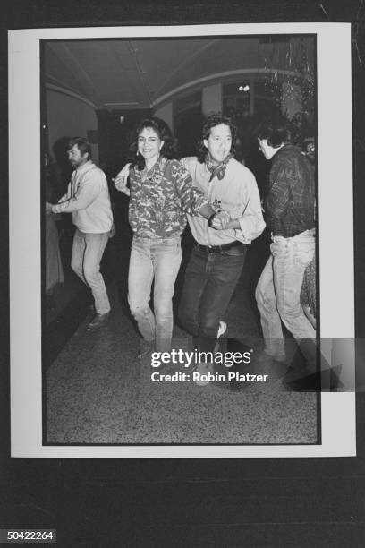 Actress Polly Draper w. Pal, music dir. Michael Wolff dancing in celebrity square dance.