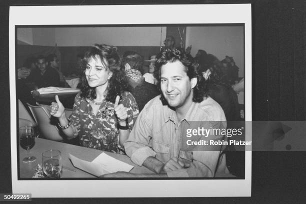 Actress Polly Draper w. Pal, music dir. Michael Wolff at table, having drinks at celebrity square dance.