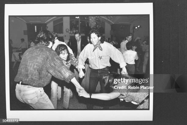 Actress Polly Draper w. Pal, music dir. Michael Wolff , dancing in celebrity square dance.