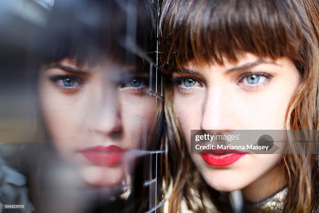 A model reflected in a mirrored wall