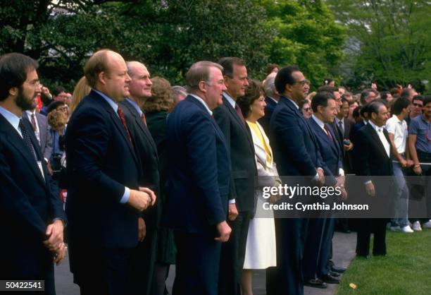 Bush & Cabinet members Weinberger, Pierce, Dole, Meese, Baldrige & Brady seeing Pres. Reagan off , on WH lawn.