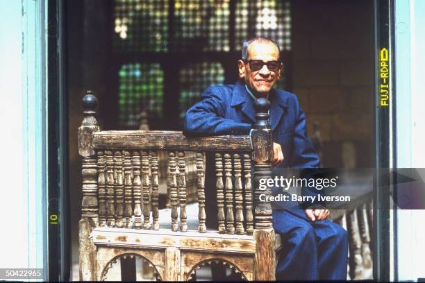 Nobel Prize winning author Naguib Mahfouz at old Arab courtyard home, Beit al-Suhaymi, in Gamaliya quarter where he grew up.