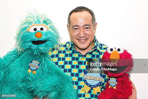 Sesame Street characters Rosita, Alan Muraoka, and Elmo pose backstage at Sesame Street and HBO Host Free Museum Day with a special performance by...
