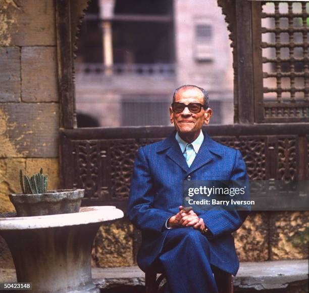 Nobel Prize winning author Naguib Mahfouz at old Arab courtyard home, Beit al-Suhay-mi, in Gamaliya quarter where he grew up.