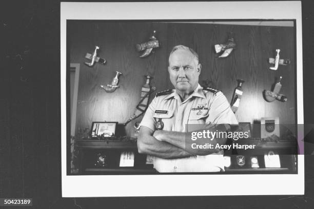 Army Gen. Norman Schwarzkopf, Cmdr-in-Chief of US Army Central Command, wearing short-sleeved army shirt as he poses in front of wall covered w. His...