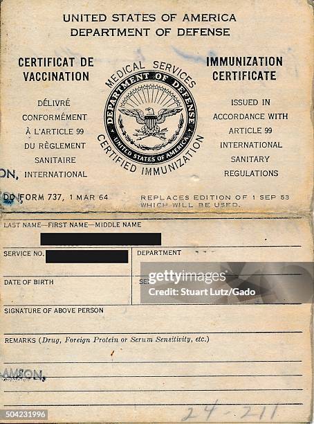 United States Department of Defense medical services immunization certificate, listing the name and identity of a soldier who has been vaccinated...