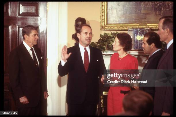 Atty. Gen. Dick Thornburgh raising hand, being sworn-in by Justice Scalia , w. Wife Virginia holding bible as Pres. Reagan & VP Bush look on.