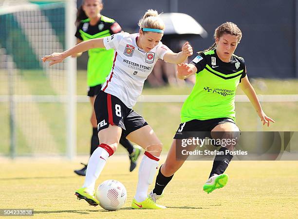 Erica Halloway of the Wanderers and Julia De Angelis of Canberra United contest possession during the round 13 W-League match between Canberra United...