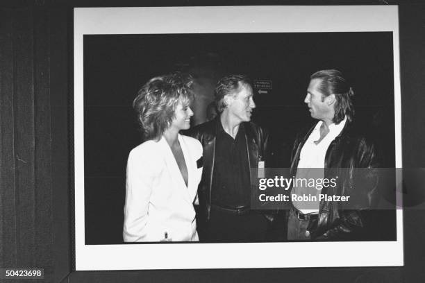 Actor James Woods w. His date Liz Hilden chatting w. Actor Jeff Bridges at party for HBO's Comic Relief IV, a telethon which raises money for...