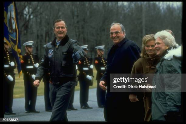 Pres. George Bush & wife Barbara greeting W. German Chancellor Helmut Kohl & wife Hannelore, on arrival at Camp David.