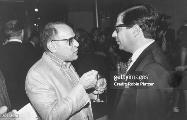 Publisher Howard Kaminsky talking with writer Bob Colacello at book party.