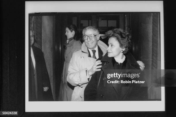 Minutes producer Don Hewitt behind his wife Marilyn Berger,leaving Temple following funeral of former head of CBS, William Paley.