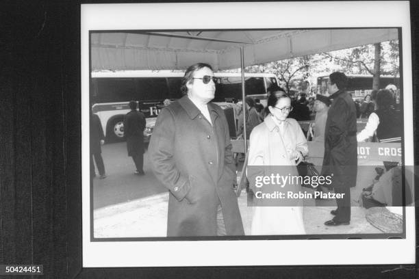 Bandleader Peter Duchin and wife, writer Brooke Hayward, entering Temple for William S. Paley's funeral.