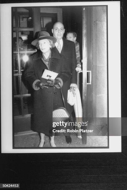 Socialite Brooke Astor in large hat w. Reinaldo Herrera leaving Temple where William S. Paley's funeral was held.